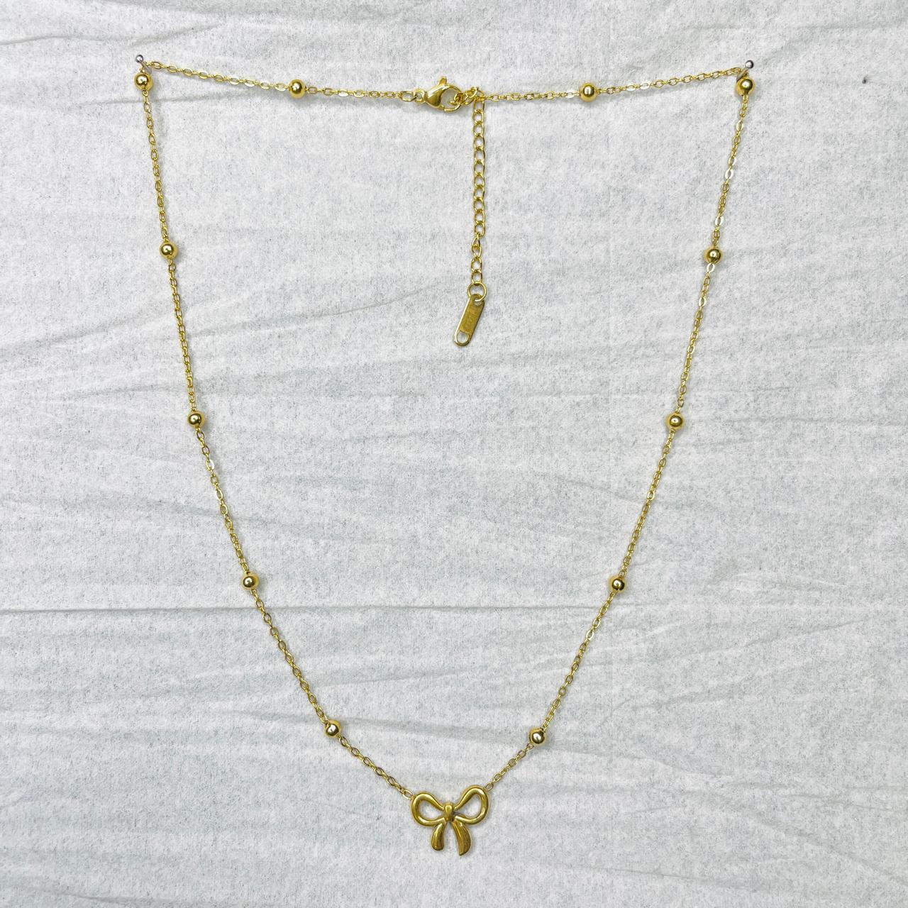 SAAT917  GOLD-PLATED BEADED BOW PENDANT NECKLACE